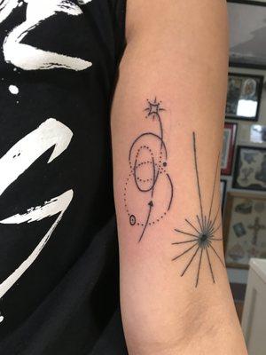 Shooting star geometric tattoo (left) done by Alexis