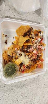 The portion of the carne asada super nachos we're throwing away.