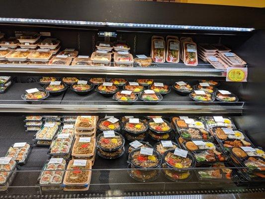 Dinner goodies within the refrigerated case.