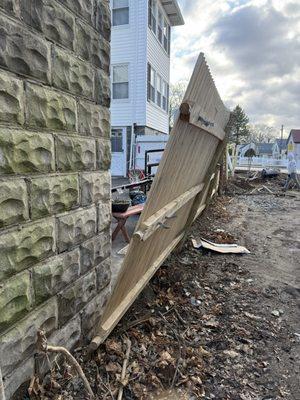 Fence Falling down because Ed Feeney did not install my neighbor's fence properly