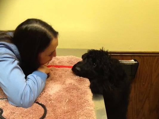 Veterinarian Assistant and patient share a moment