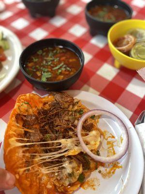 Quesabirria taco and Consome de Birria $3.99 taco