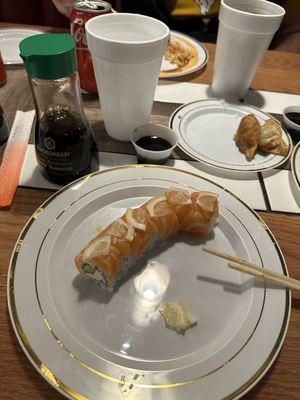 Plastic plates, styrofoam cups, lemon tree roll, gyoza