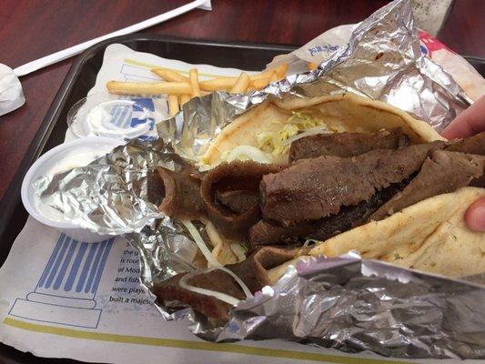 Gyro combo.  Gyro with lettuce, tomato, tzaziki, onion on a pita.  Comes with fries and a drink.  Quite good!