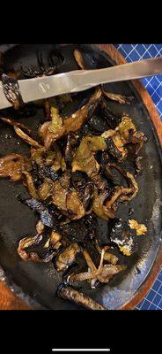 "Cooked" / Burnt fajita veggies.