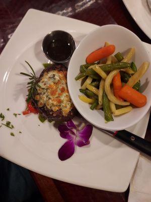 Filet mignon with gorgonzola crusted cheese with vegetable madley. Melted in your mouth