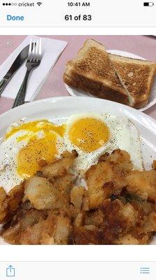 Two eggs, home fries, and toast