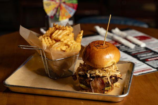 BBQ Brisket Burger - House Smoked Brisket, Aged Cheddar, Crisp Bacon, Onion Strings, Pickles, TX Whiskey BBQ Sauce