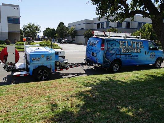 Elite Rooter service van and trailer fully equipped, ready for any plumbing job, parked and prepared for the next task.