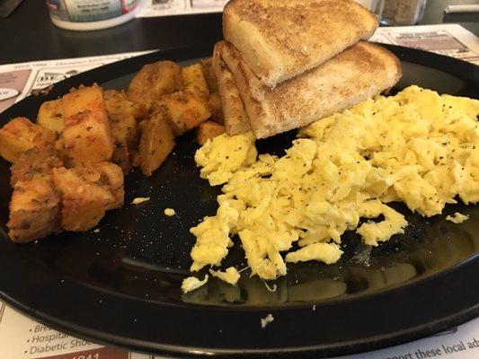 Breakfast of eggs, home fries and toast. Place was recently remodeled with new floors and bench coverings.