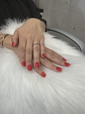 "Feeling bold with these red nails!  Nothing like a classic red to make a statement. #RedNails #BoldAndBeautiful #NailGoals"