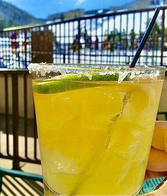 Happy Tuesday, cheers! margarita outside with view of the snowy ski slopes