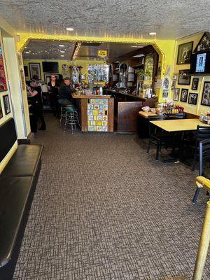 The entrance to Arthurs. Bar area and a couple tables straight ahead. Left side of picture is main dining room, back patio is past bar area.