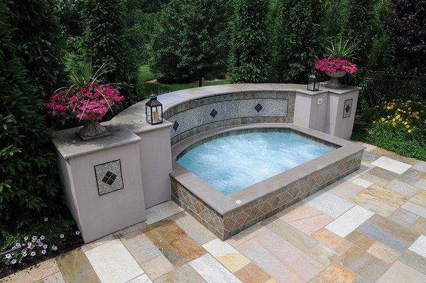 Custom gunite spa makes a lovely addition to a home.