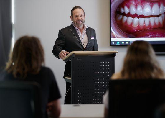 Dr. Dennis Wells giving an educational lecture in our teaching center