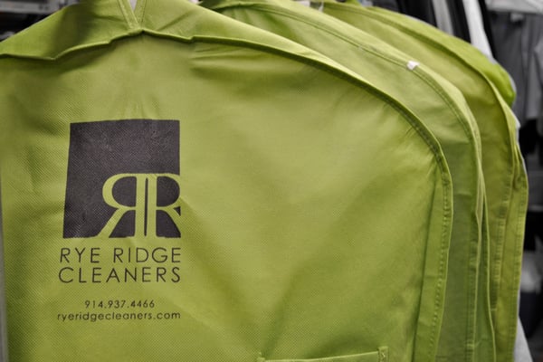 We offer a reusable garment/laundry bag instead of those plastic dry cleaning bags