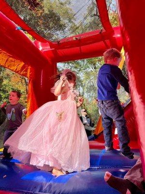 Princess Anna Louise and friends having fun in a bouncy castle.