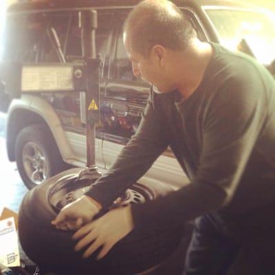 Luis fixing my tire. He's a pro and great company.