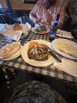 Ribeyes, shrimp scampi, fresh roll, portobello mushroom ravioli.