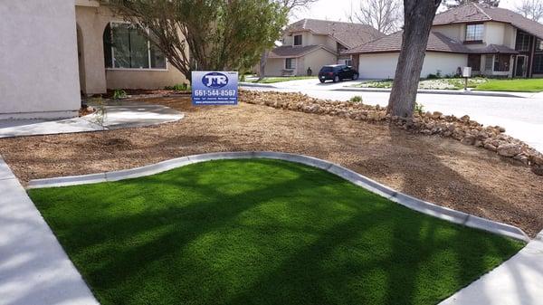 Artificial turf softens the look of this beautiful desertscape project