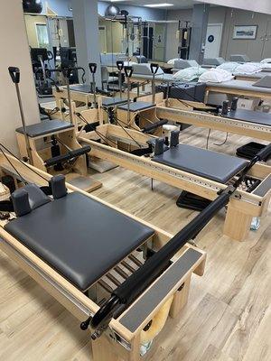 Pilates Reformers and Wunda Chairs.