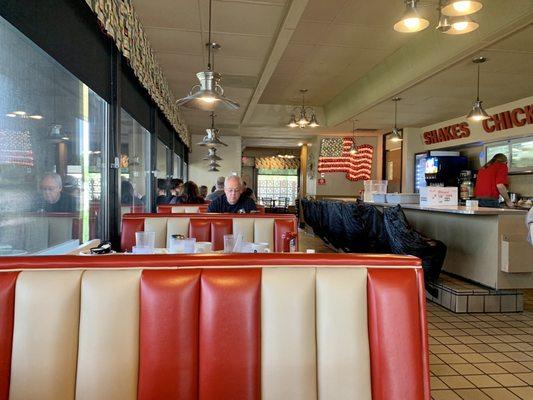 I sat in a booth alongside the high-top bar area.