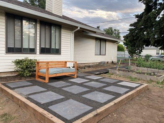 Gravel patio with pavers and lumber edging