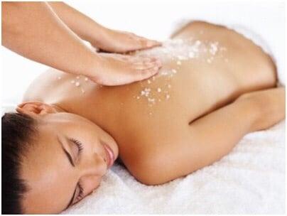 Body scrub before a massage session promotes silky skin.