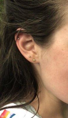 Helix piercing! (Lobes courtesy of Claire's, body tech, body tech again, and a mall kiosk... Addiction is the superior choice!)