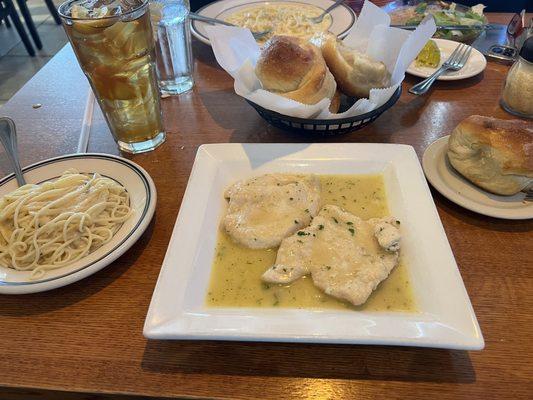 Chicken piccata with a side of pasta and garlic rolls !! yum!