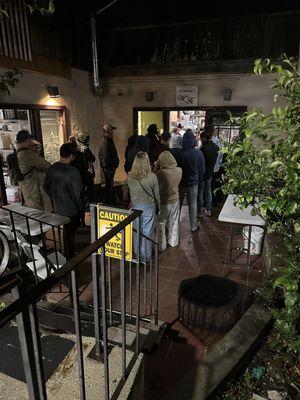 Crowd of 15+ people waiting for their takeout. Orders were 45+ minutes late to come out.