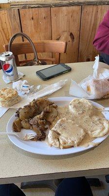 Sausage gravy and biscuits, a plain one for later and an egg and cheese for later later.