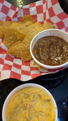 Chips with salsa and queso (what's left of the chips)