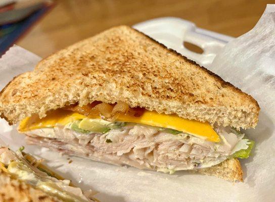 Turkey Club add onion, avocado, cheddar cheese and jalapeño aioli