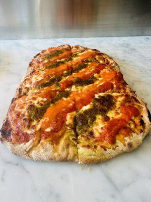 Fresh flatbread pizza with pesto ,vodka sauce and tomato sauce