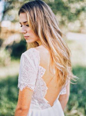 Swoon worthy low back with scalloped edge lace.