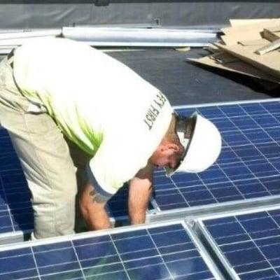 Mechanic installing solar