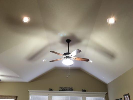 Living room vaulted ceiling updated with LED eye ball cans and updated ceiling fan with LED lighting.