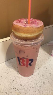 Pink velvet iced latte with strawberry frosted donut