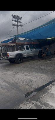 Guy doing a great job washing my work truck.