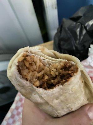 Inside the Asada Burrito. Meat was good, tender, definitely softer and more cut down then I'm used to.