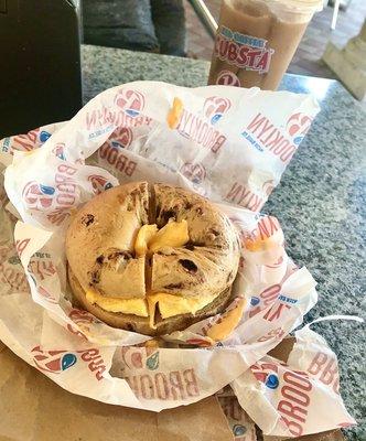 Cinnamon raisin bagel with egg and American cheese & Cubsta iced coffee