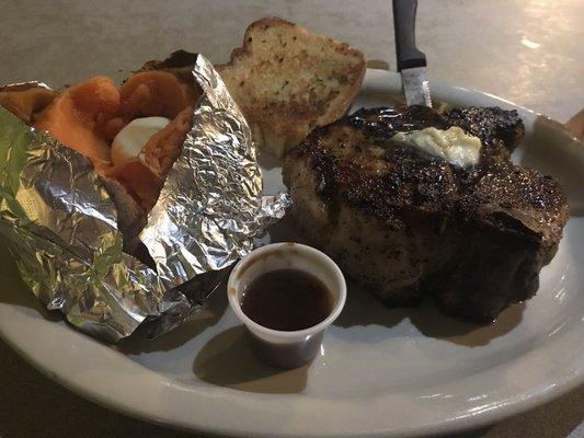 Pork chop with baked sweet potato.