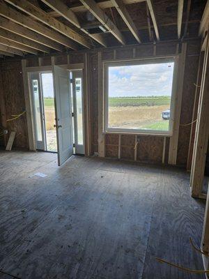 Installed support rafters had hvac & electrical work installed.  Installed picture window & double window front door.