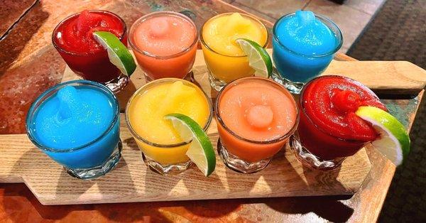 It's like a rainbow but of margaritas! Our Frozen Flight of margaritas lets you choose four of your favorite flavors of margaritas.