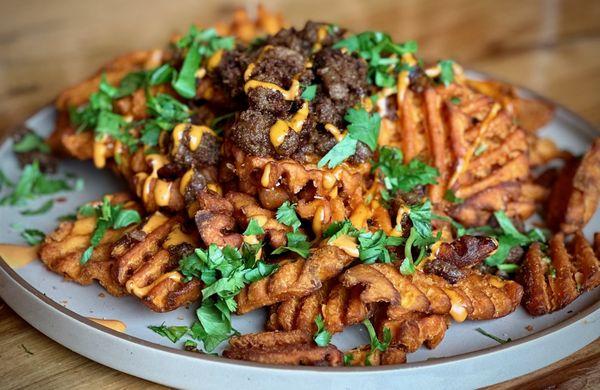 Sweet Potato Waffle Fries
Sweet and salty sweet potato mini-waffles served with your choice of: Truffle-Parmesan or Queso