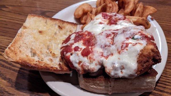 Chicken parmesan sandwich and cottage fries.