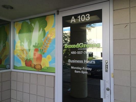 Boxed Greens is located north east of Elliot and I 10 in Tempe Arizona.  The entrance Is labeled Grove Commons.