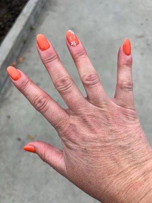 Dip manicure, almond shaped with flower design on ring fingernail