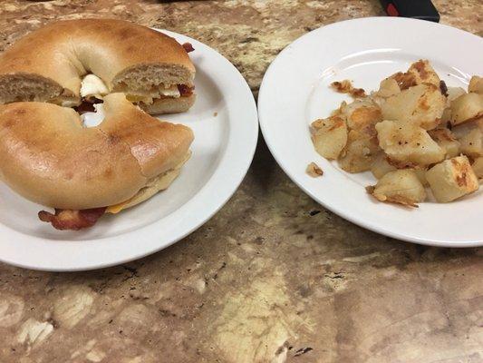 Bacon egg and cheese bagel and home fries.